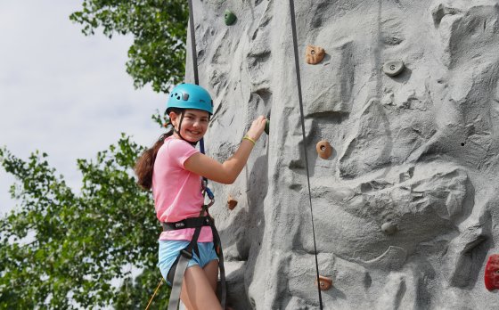 Kid climbing at Camp Bay View