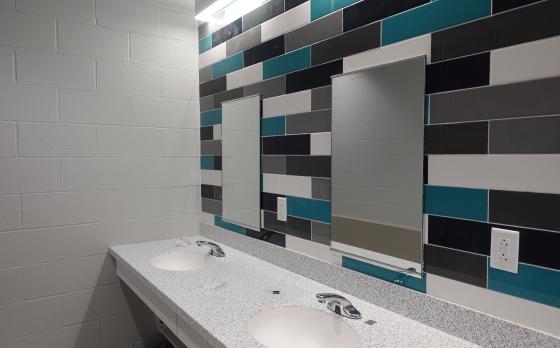 sinks and counter areas at the sands family ymca in a locker room