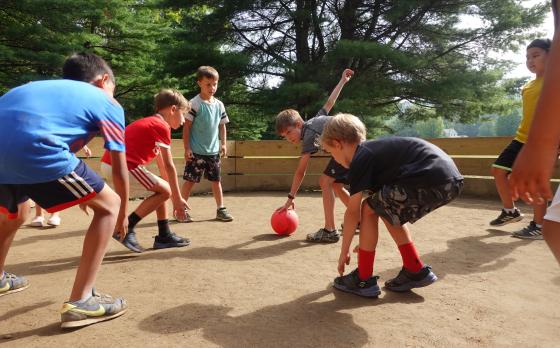 a group of boys playing gaga at Camp Watson Woods