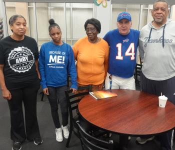 Members and staff at the Maplewood Family YMCA pose together during a grieving group session at the branch.