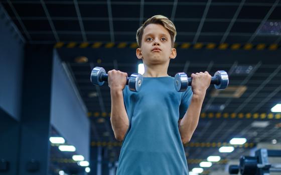 boy doing bicep curls 