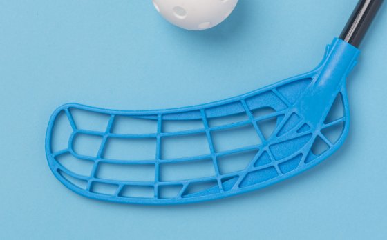 picture of a wiffle ball and blue and black plastic sports stick