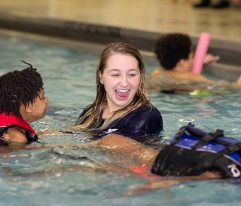 kids in a pool for swim lessons at ymca of greater rochester