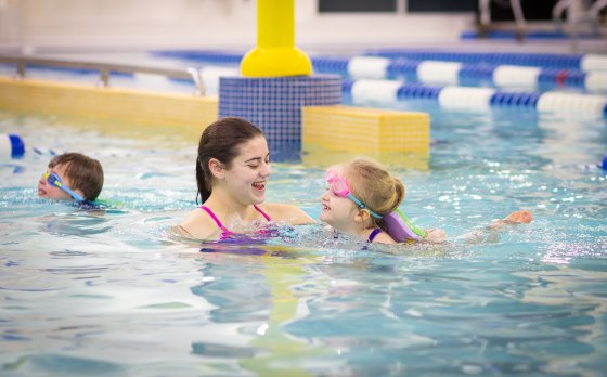 Little Girl Learning How To Swim