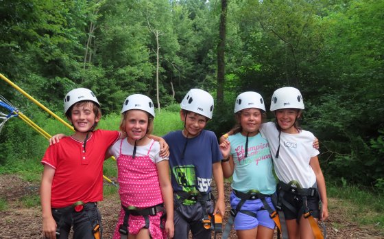 Kids ziplining at Eastside Camp