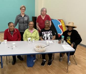 Karen Blank stops for picture with members of the Maplewood Family YMCA during a health talk in partnership with URMC and the YMCA