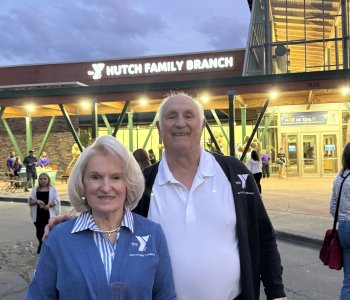 Ray and Erika Hutch stand in front of the newly named Hutch Family Branch in Penfield