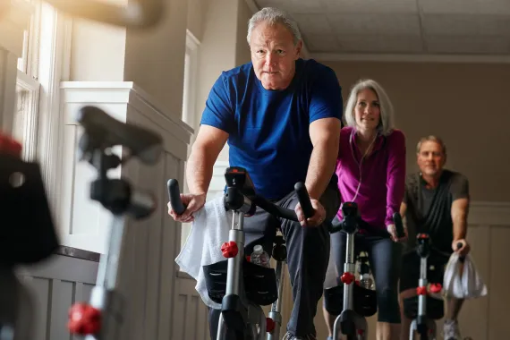 people exercising on bikes