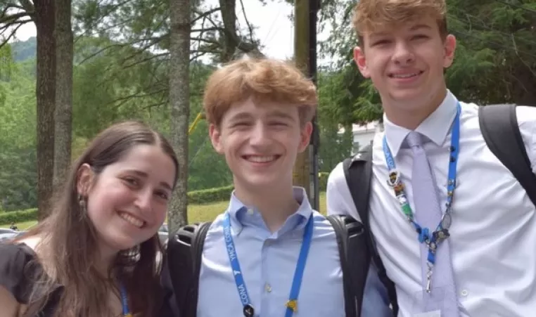 Three teens outside at a youth and government conference